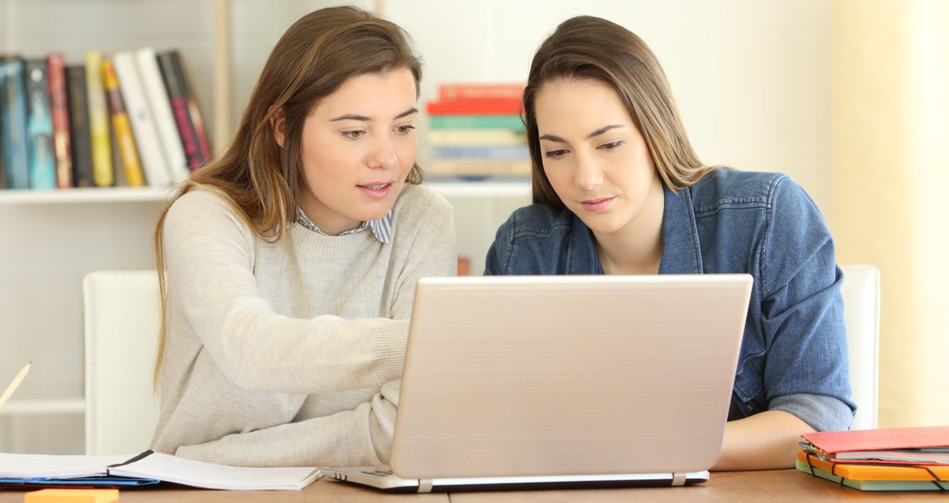 students applying to university on a laptop